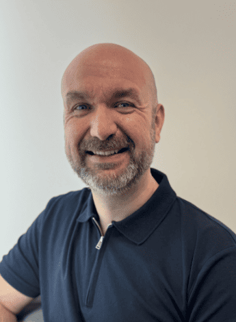 The image is of Carl Clarkson, a physiotherapist who uses dry needling and acupuncture. 